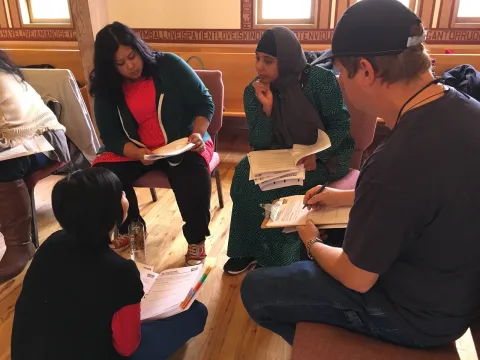 Small group discussion at a popular education training.