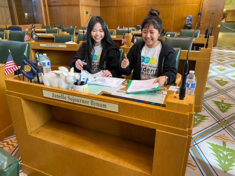 two students preparing a presentation inside Oregon's capitol