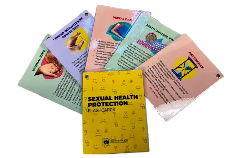 Several colorful sexual health education flashcards fanned out in display.