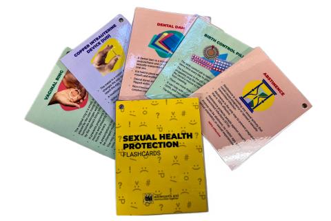 Several colorful sexual health education flashcards fanned out in display.
