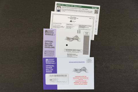 Multnomah County Elections' ballot packet content with tax message in red font