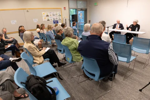 Commissioner Moyer speaking to audience at the June town hall 2025