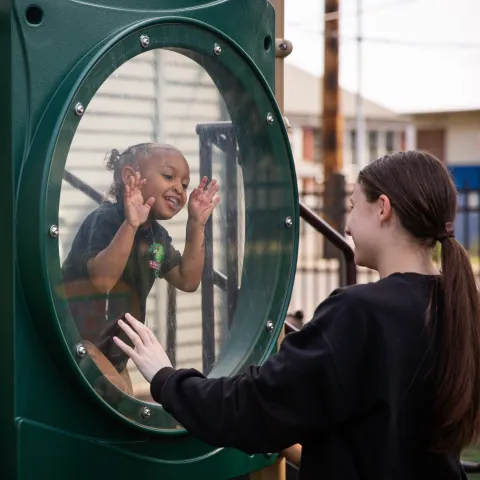 Child and teacher on playground