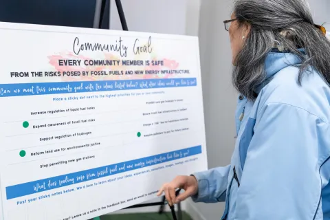 Woman looking at CJP goal board