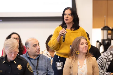 DCJ Director Denise Pena addresses audience at event