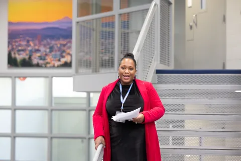 Juvenile Services Division Director Kyla Armstrong Romero smiles while presenting at renovated pod opening