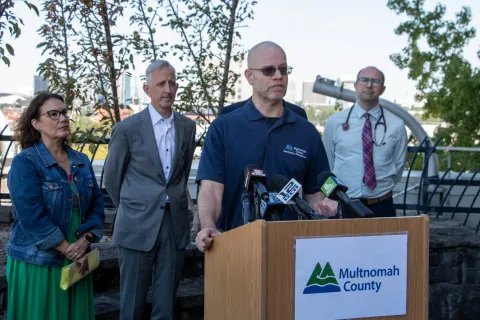 Officials speak at a heat press conference