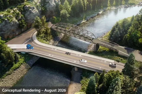 Rendering of an aerial view of a new larger bridge next to the existing Stark Street Bridge. Label reads "Conceptual Rendering August 2026".